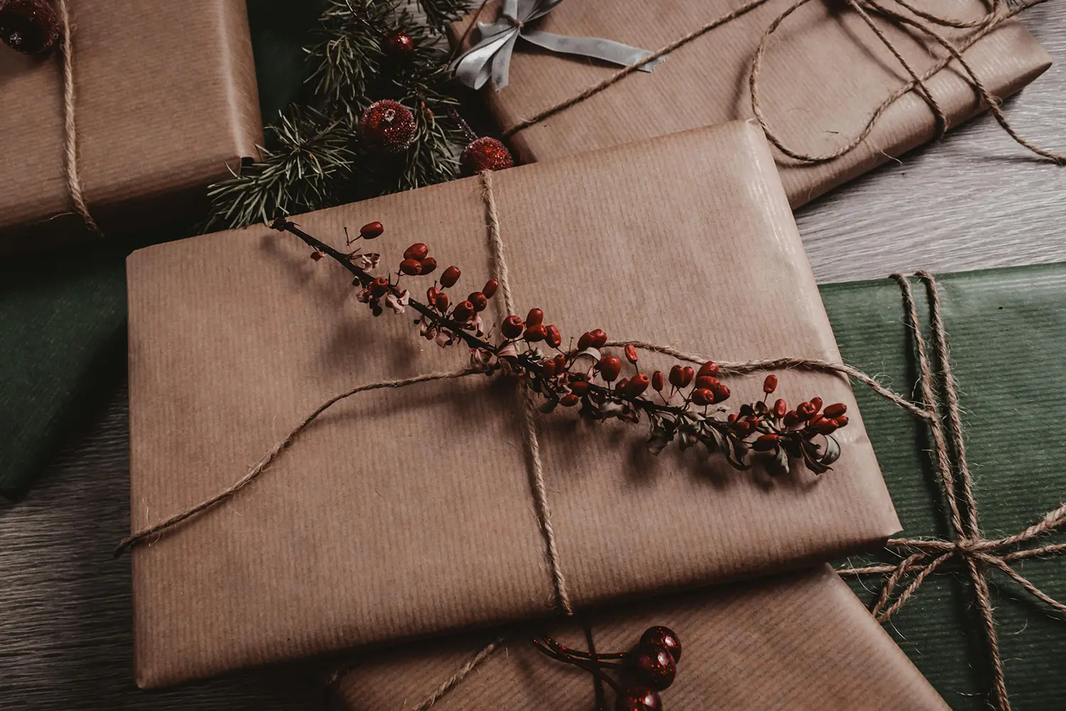 Natural paper wrapped gift with a dried rowan decor